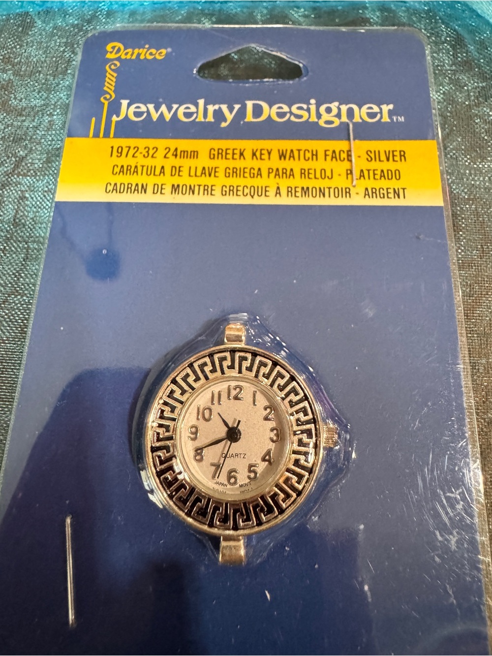 Darice silver and black packaged watch face